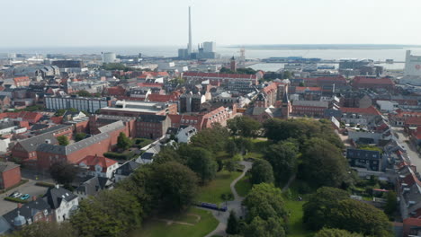 Aerial-view-of-the-city-of-Esbjerg-in-Denmark-with-carateristic-brick-wall-building.-Backwards-revealing-the-harbour,-one-of-the-largest-of-the-North-Sea