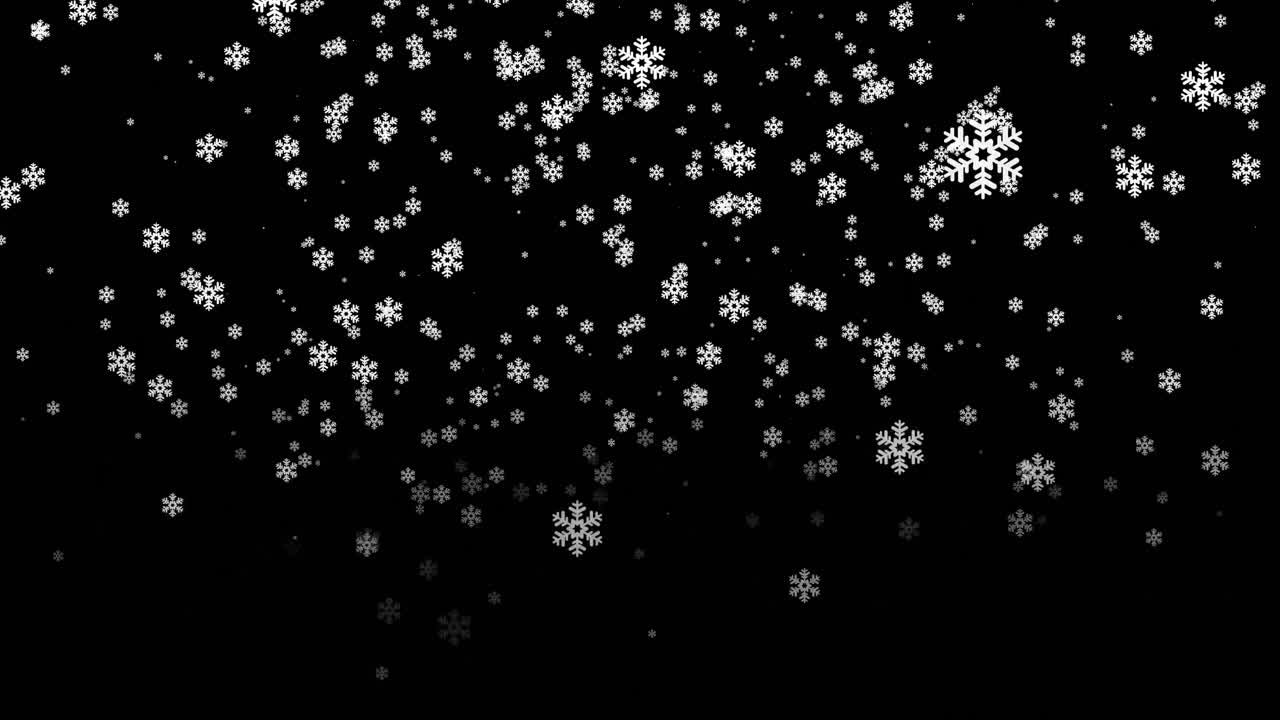 Snøflak faller på svart bakgrunn