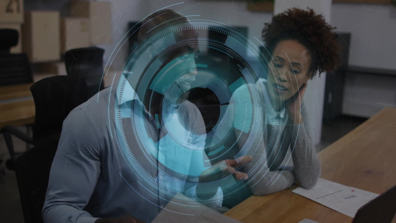 Colleagues reviewing charts and examining smartphone data with interface overlay in business office