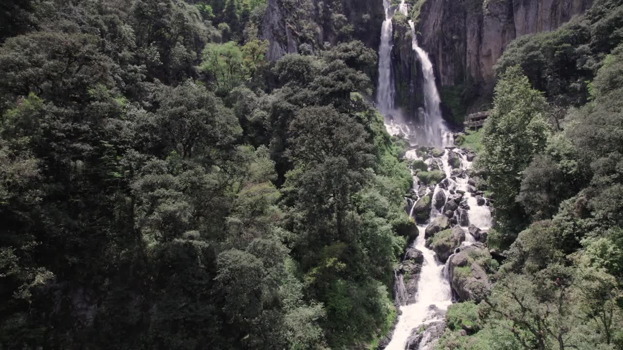 Waterfall and River in the Mountainsduring summer day: Aerial Drone View of Nature's Splendor in South America
