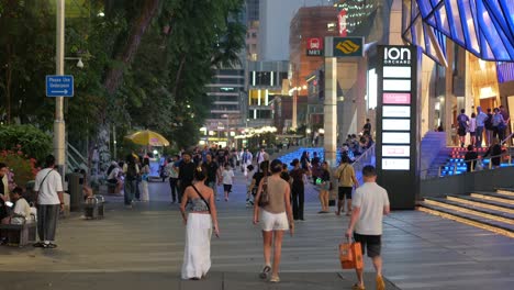 evening crowds at ion orchard on singapore's bustling orchard road