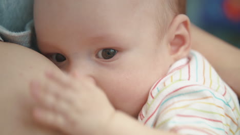 Breastfeeding-baby-face.-Lovely-infant-eating-mother-milk.-Sweet-motherhood