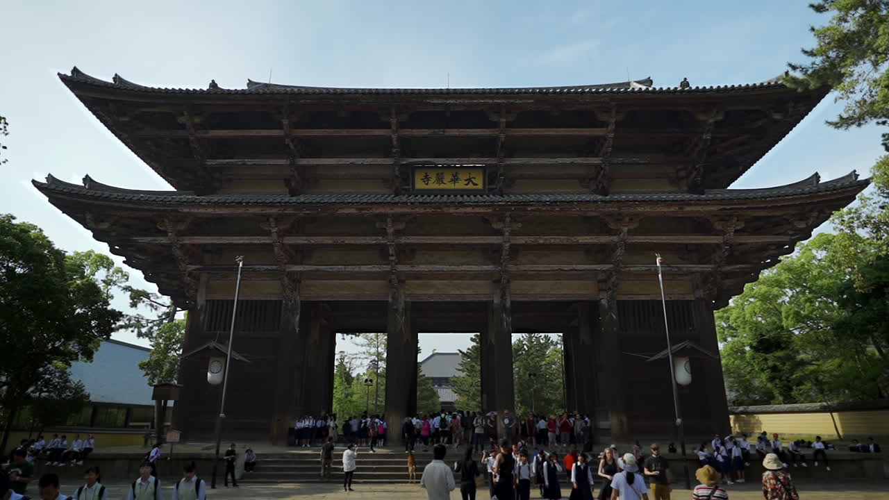 The Great South Gate on the way to Todaiji and adjacent to Nara Park, Nara, Japan, wide dolly in slow motion.