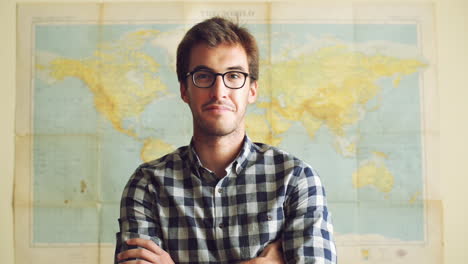 Young-tourist-travel-man-portrait-world-map-background