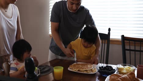 Family-enjoying-time-relaxing-together-at-home