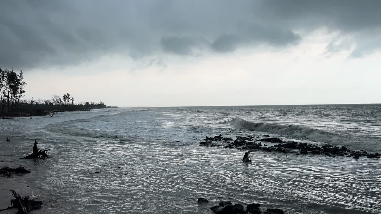 An Indian sea beach with dark clouds in monsoon of West Bengal