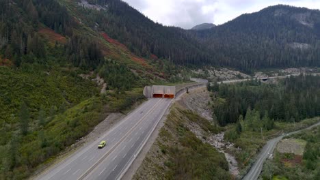 drone overhead shot of coquihalla's great bear snow shed entrance of the trans canada highway