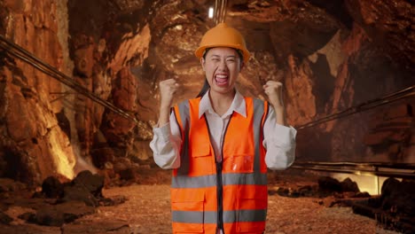 excited female engineer in a tunnel
