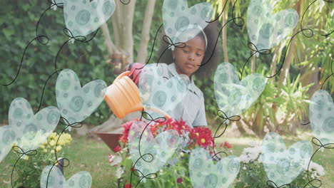 animatin of heart ballons over african american girl watering plants in garden