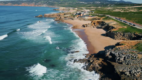 picturesque rocky sea coast aerial view. ocean waves splashing in slow motion