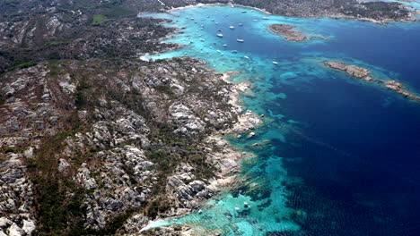 top down aerial drone view of beautiful caprera coastline in sardinia, italy