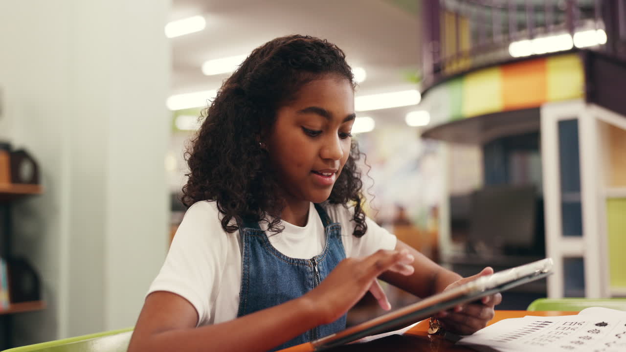 Girl Using Tablet in Library