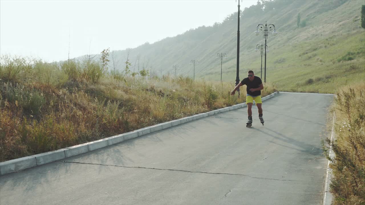 Man Rollerblading on a Park Path