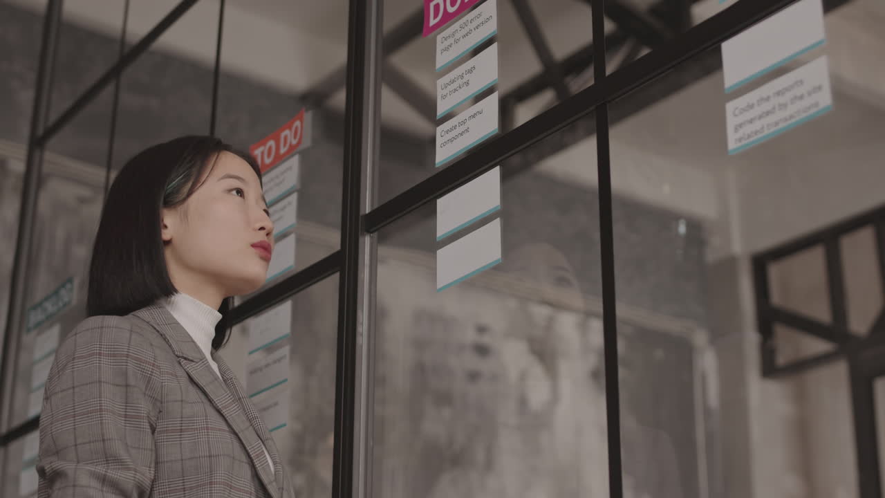 Asian Woman Writing on Note Cards