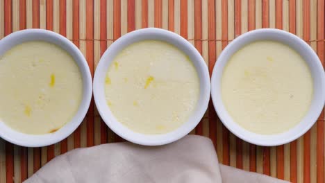 three small bowls of custard