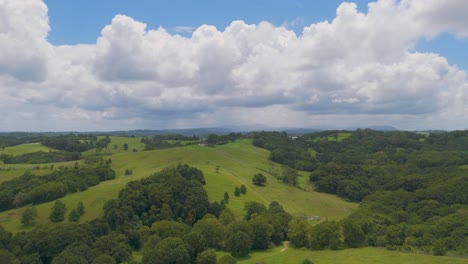 lush green hills under a cloudy sky