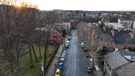 aerial of small usa town during winter sunrise