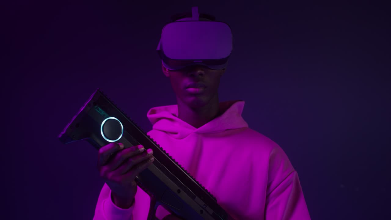 Man wearing VR headset holding a laser gun