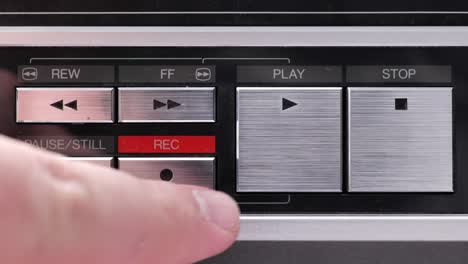 extreme close up of buttons on an old antique or vintage vcr pushing record