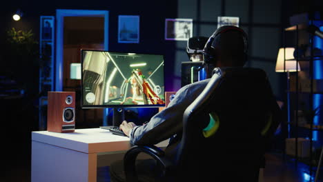 dejected man hitting desk after seeing game over message on computer screen