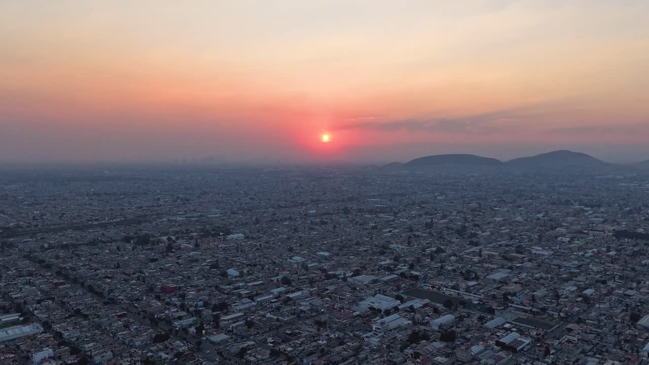 Hyperlapse footage from a drone at sunset over Ecatepec’s urban neighborhood