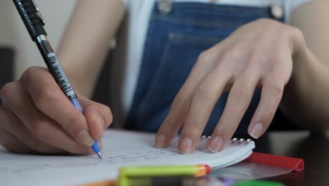 girl writing assay