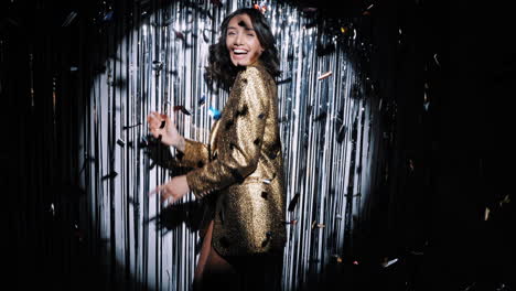 happy woman in golden outfit at a party