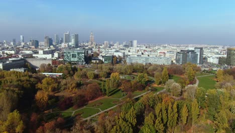 Aerial-starting-at-Stadion-Politechniki-Warszawskiej-Syrenka-one-of-Warsaws-green-areas-and-flying-towards-modern-stock-exchange-buildings