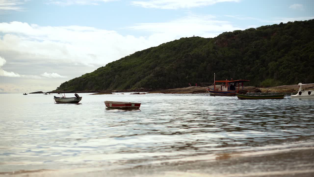 Handheld fishing boats on the shore of Tartaruga beach in B&uacute;zios, Brazil