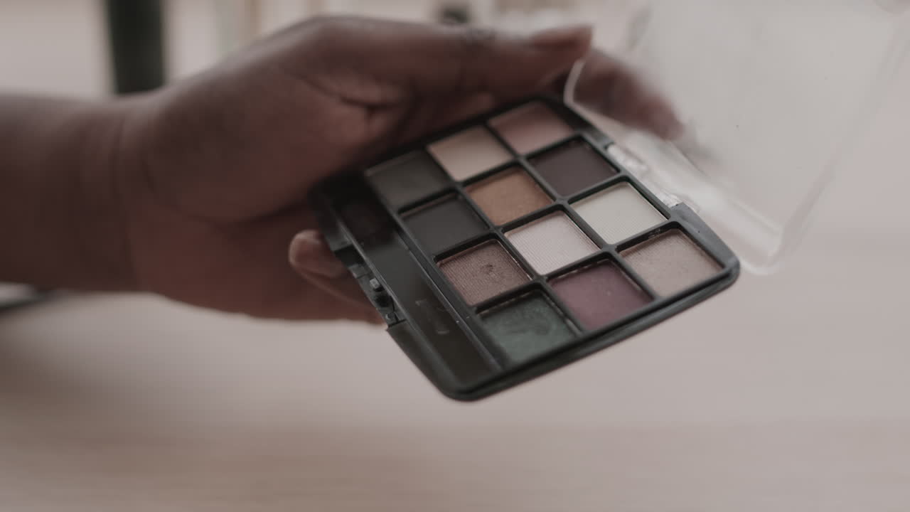 Unrecognizable African-American Woman Doing Makeup