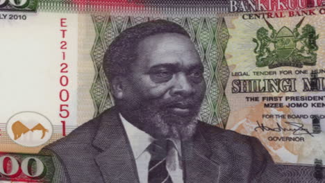 kenyan 100 shilling banknote with jomo kenyatta portrait on green screen