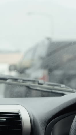 hand of driver on car wheel