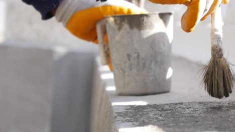 applying a sealant to concrete blocks