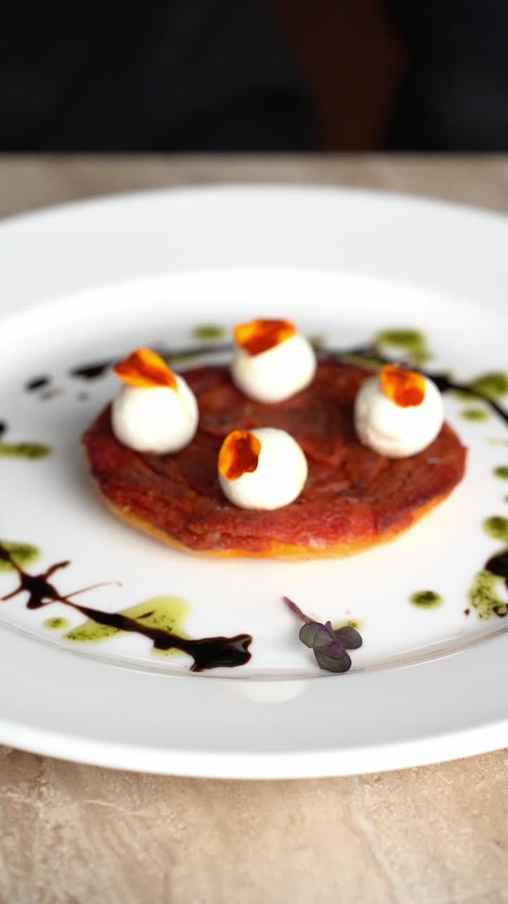Chef Garnishing a Gourmet Appetizer with Microgreens