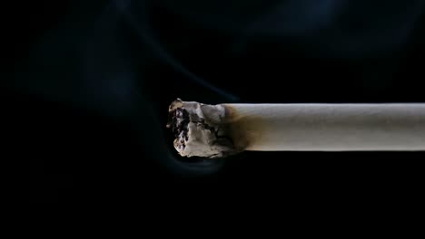 Close-up-clip-of-lit-cigarette-with-smoke-rising