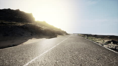 scenic road through mountains at sunrise