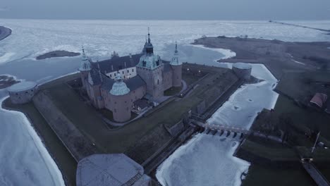 cinematic aerial view of kalmar castle during winter