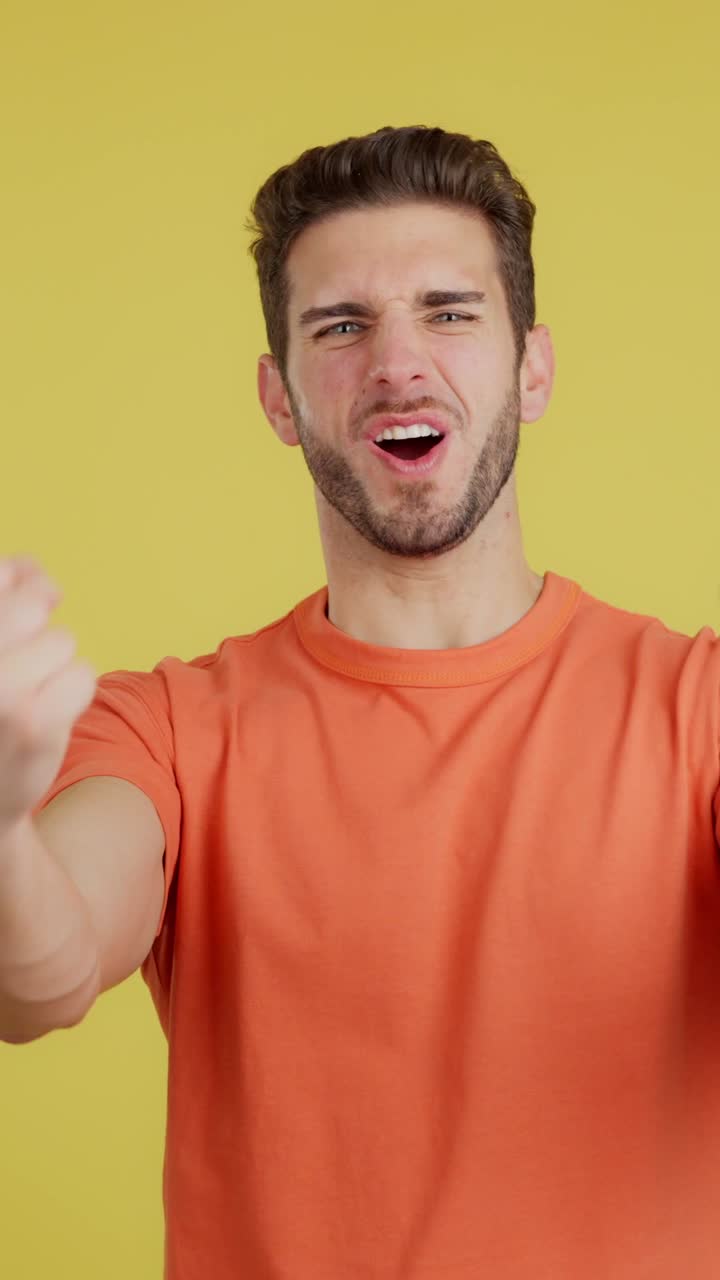Man celebrating success with triumphant expressions and clenched fists