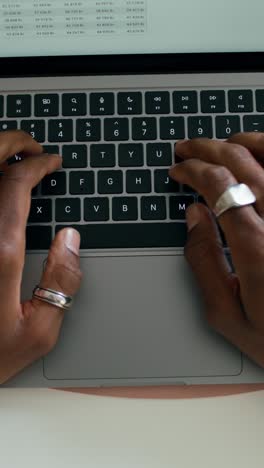 person typing on laptop