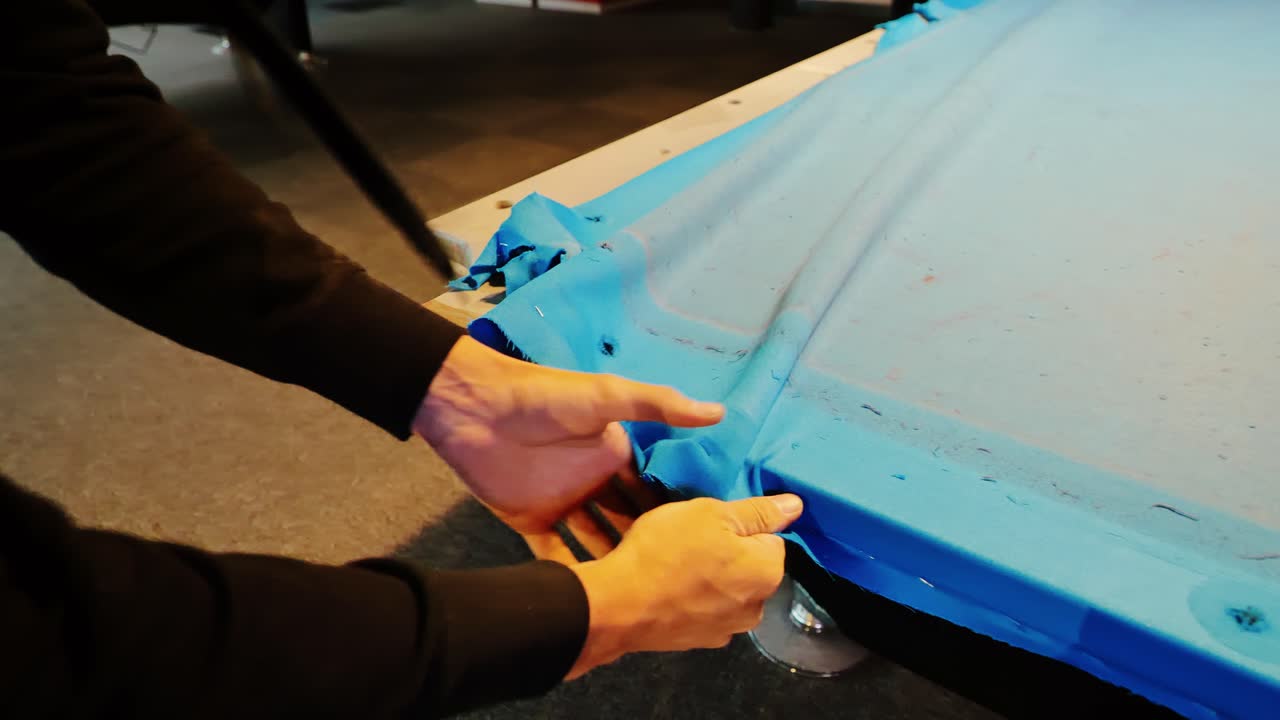 Pool table fabric removal by professional shows start of detailed indoor repair