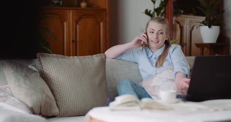 relaxed smiling woman talking on mobile phone at home 1