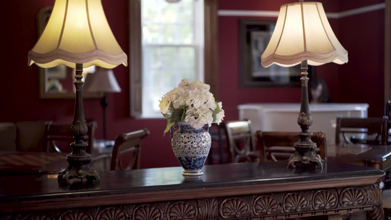 Interior with table lamps and flower arrangement
