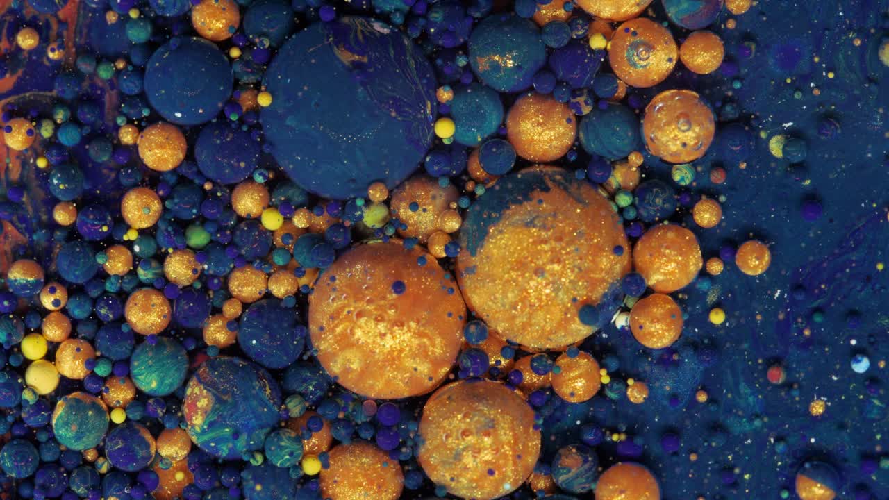 fondo pastel en movimiento que consta de bolas púrpura-azul que se mueven de una manera caótica.