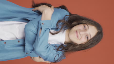 Vertical-video-of-The-young-woman-hugs-the-camera.