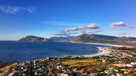 south african windy kommetjie lighthouse seaside port city town drone aerial cinematic mid day afternoon cape town noordhoek chapman peak stunning spring summer deep aqua blue ocean upward motion