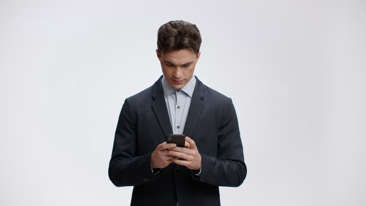 Businessman looking at smartphone