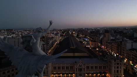 sunset statue drone shot in valencia, spain