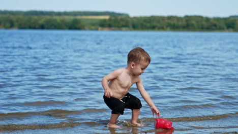 toddler playing in the water