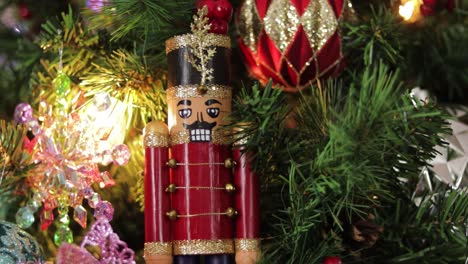 wooden toy soldier nutcracker decoration hanging on christmas tree