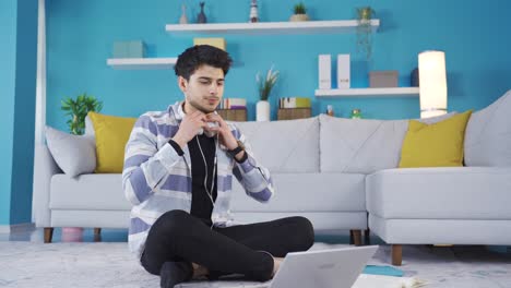 Young-male-student-at-home-is-bored-and-bored-with-lessons.